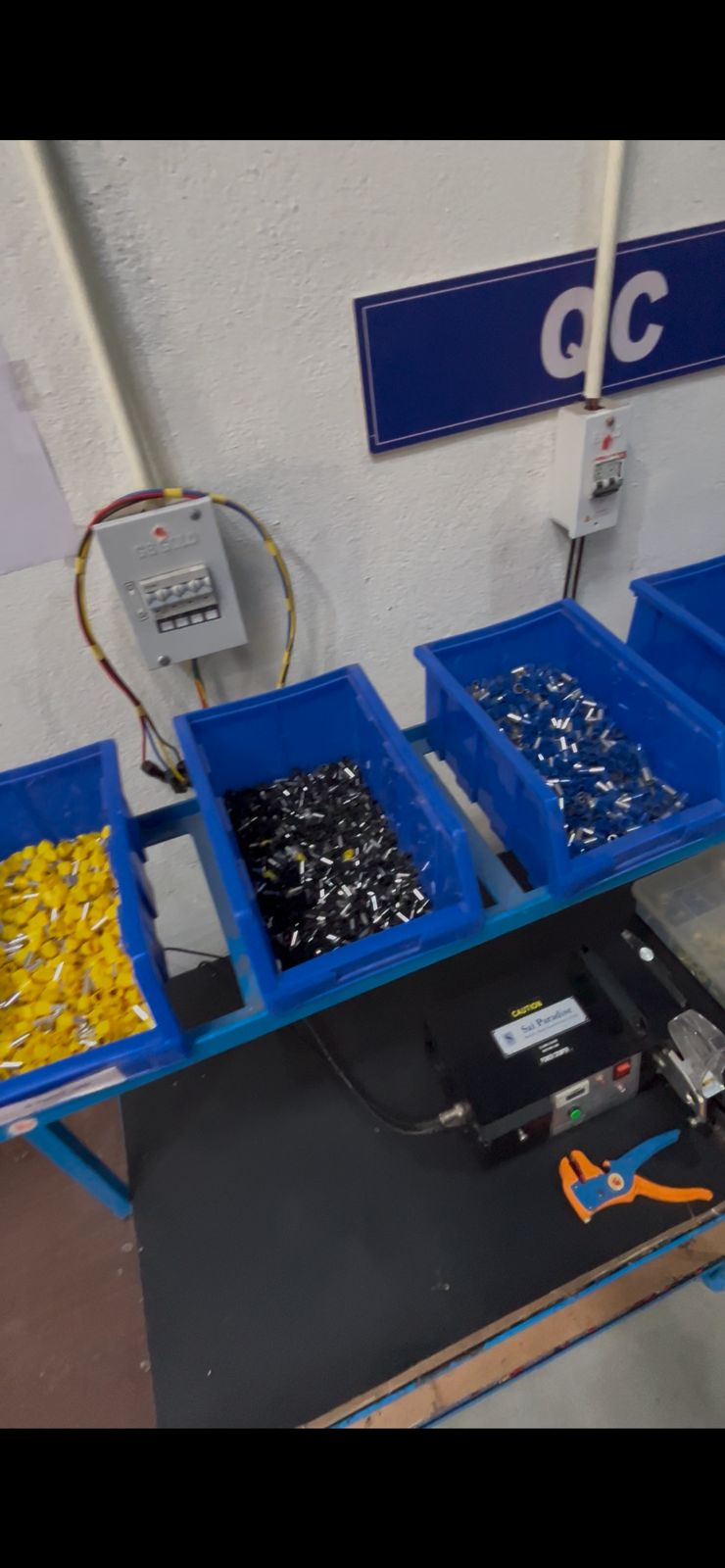 QC station — component bins and crimping machine